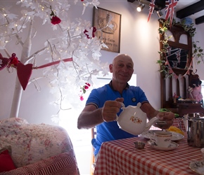 Dave pours a cup of tea at the Fairy Dust Cafe in Silloth