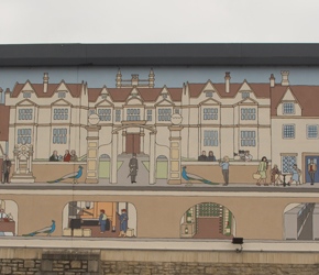 There is a large mural wrapping around the large supermarket in Corsham. It's on the left as you pass the car park and toilets in Corsham